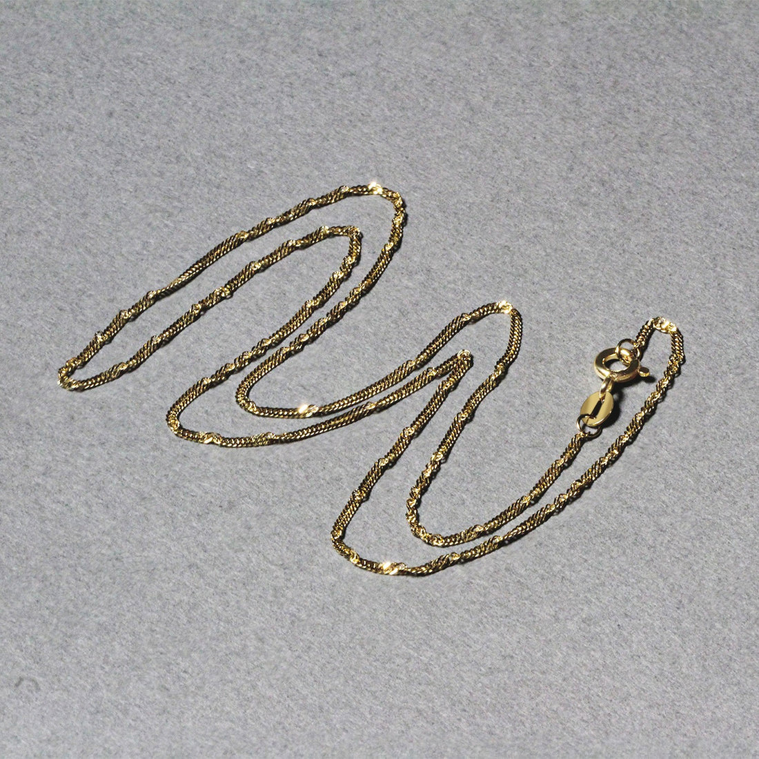 Cadena Singapur de oro amarillo de 10 k (1,50 mm)