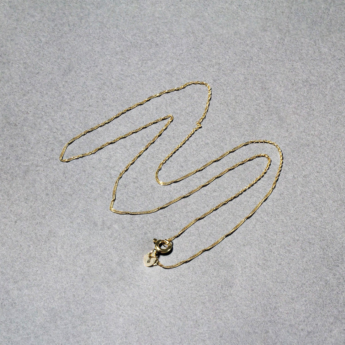 Cadena Singapur de oro amarillo de 10 k de 0,8 mm (0,80 mm)