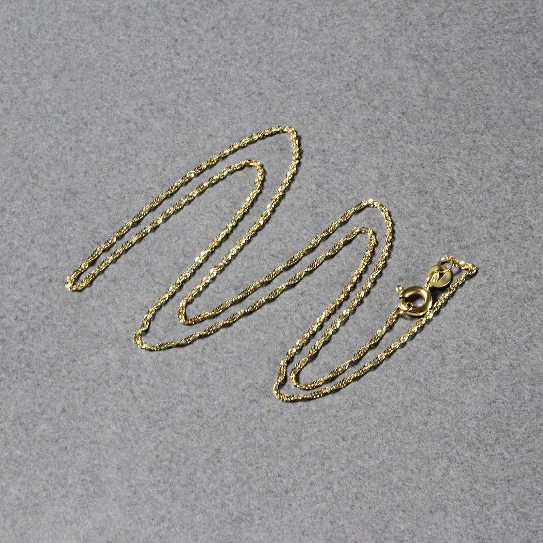 Cadena Singapur de oro amarillo de 10 k (1,10 mm)