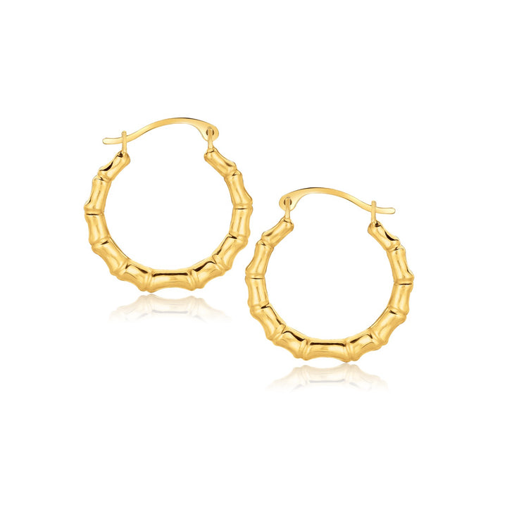 Aros con motivo de rama en oro amarillo de 10 quilates