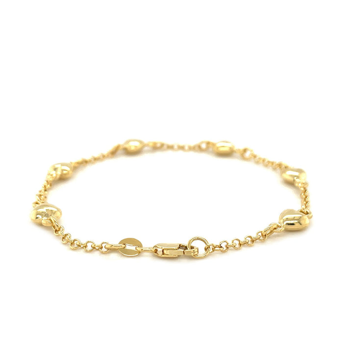 Pulsera de cadena rolo de oro amarillo de 14 k con estaciones de corazón inflado (3,30 mm)